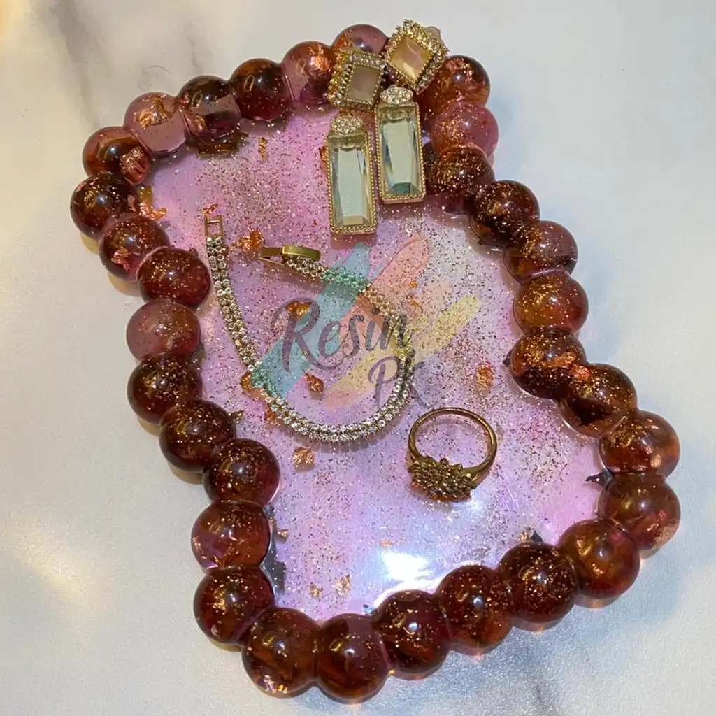 Luxury handmade pink resin bubble tray featuring gold flakes, designed for organizing earrings, rings, bracelets, and jewelry. Premium resin vanity tray handcrafted in Pakistan by ResinPK.