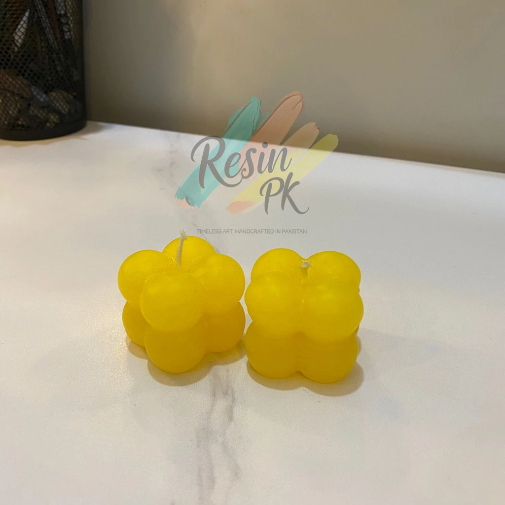 Handmade yellow bubble candle by Resin PK featuring a modern cube bubble design, perfect for home décor, coffee tables, bedroom styling, and thoughtful gifts in Pakistan.