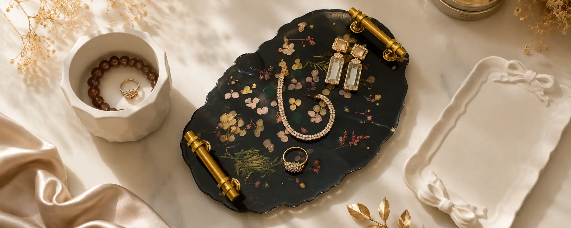 Luxury handmade black resin tray with pressed flowers and gold handles, perfect for home decor, vanity styling, and serving accessories by ResinPK Pakistan.