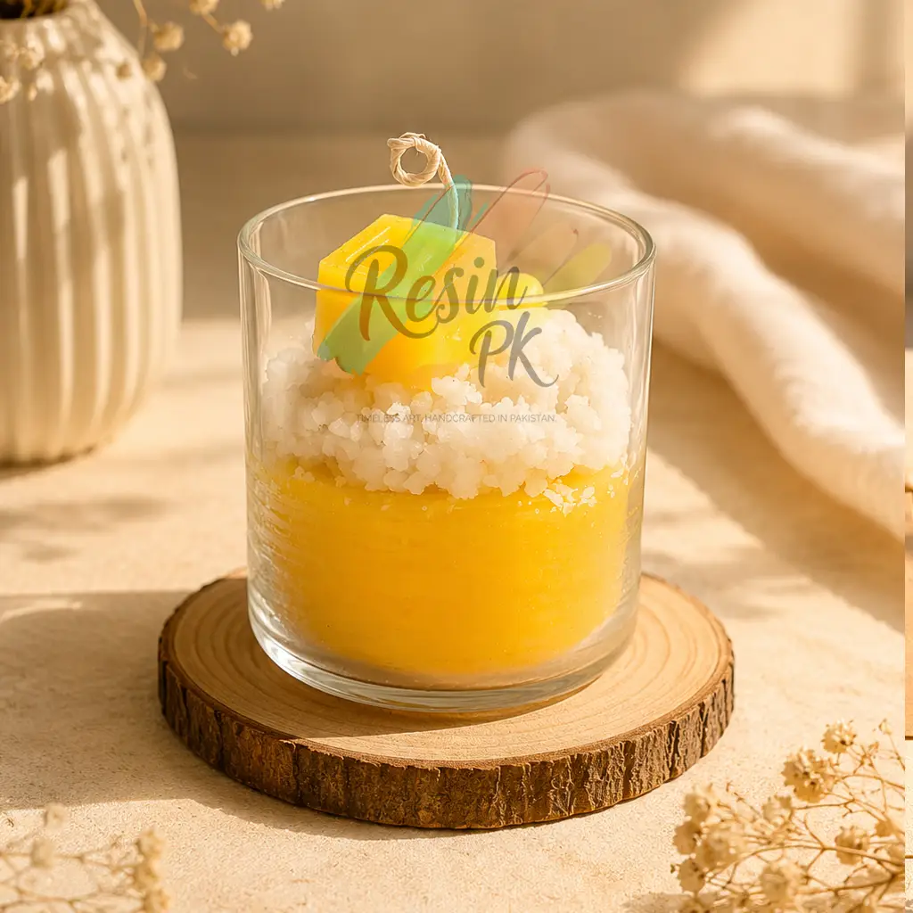 Handmade Sunrise Crystal mango Cube Candle in a clear glass jar featuring a yellow cube candle, crystal wax topping, and layered decorative wax. A modern luxury candle perfect for home décor, gifting, and aesthetic interiors in Pakistan.